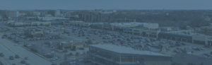 Aerial view of Miracle Mile Shopping Center in a blue tint.