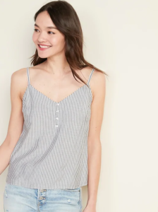 Woman wearing black and white striped spaghetti strap blouse