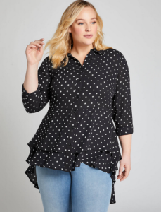 Woman wearing black blouse with white polka dots