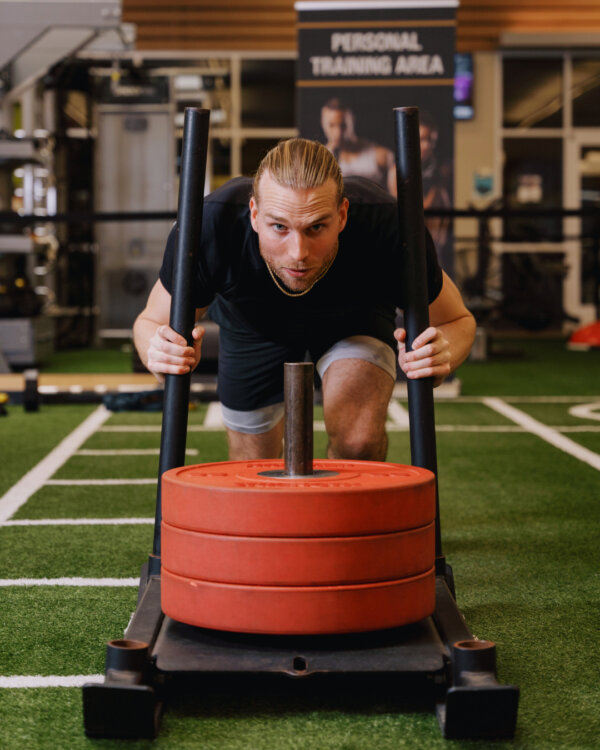 Man pushing weights