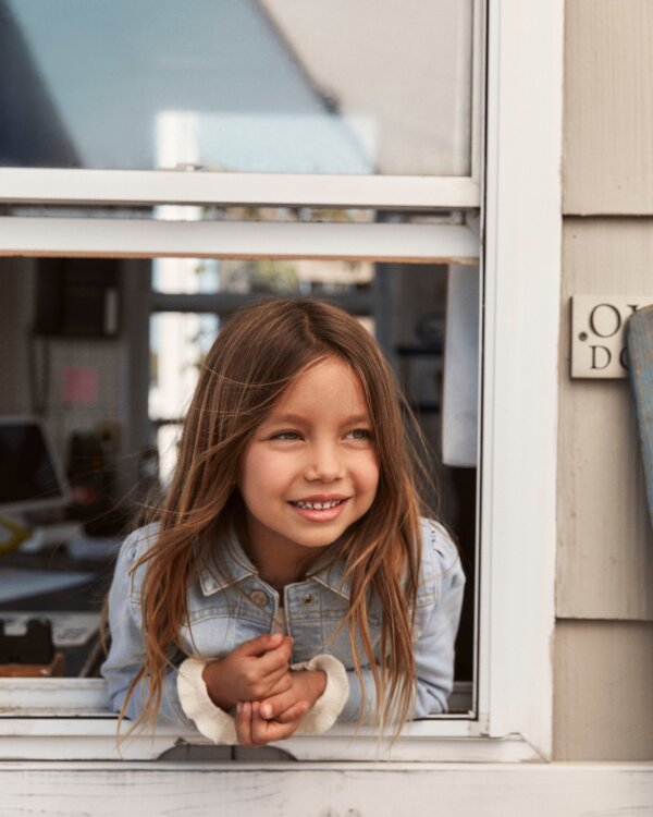 Girl looking out window